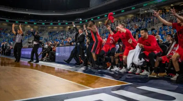 Players cheering at the basketball game