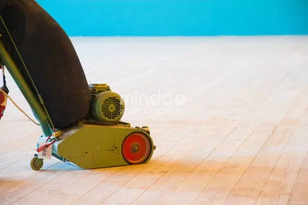 Professional sanding and finishing of solid wood sports flooring