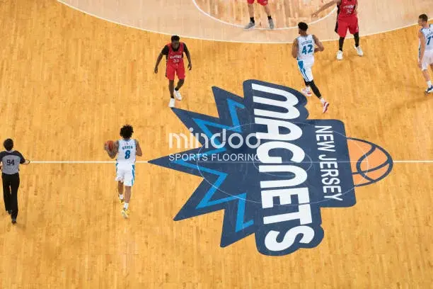 A basketball court decorated with a proprietary logo. A basketball court decorated with a proprietary logo.