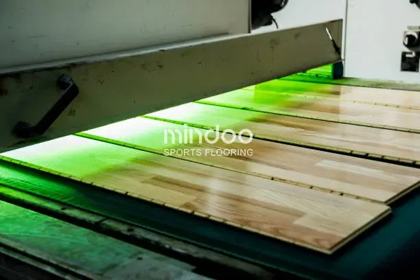 Solid wood sports flooring treated with UV-cured polyurethane. Solid wood sports flooring treated with UV-cured polyurethane.