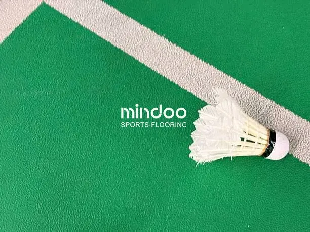 Vinyl badminton court flooring with a professional dotted design.