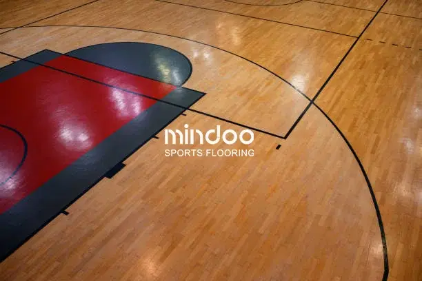 The sports venue features rich colors and natural wood grain patterns.