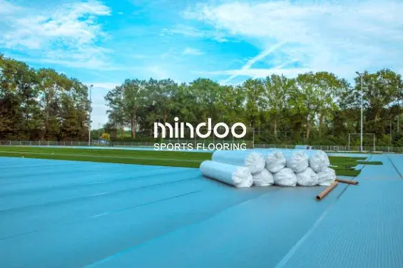 Artificial turf is being installed on the football field. Artificial turf is being installed on the football field.